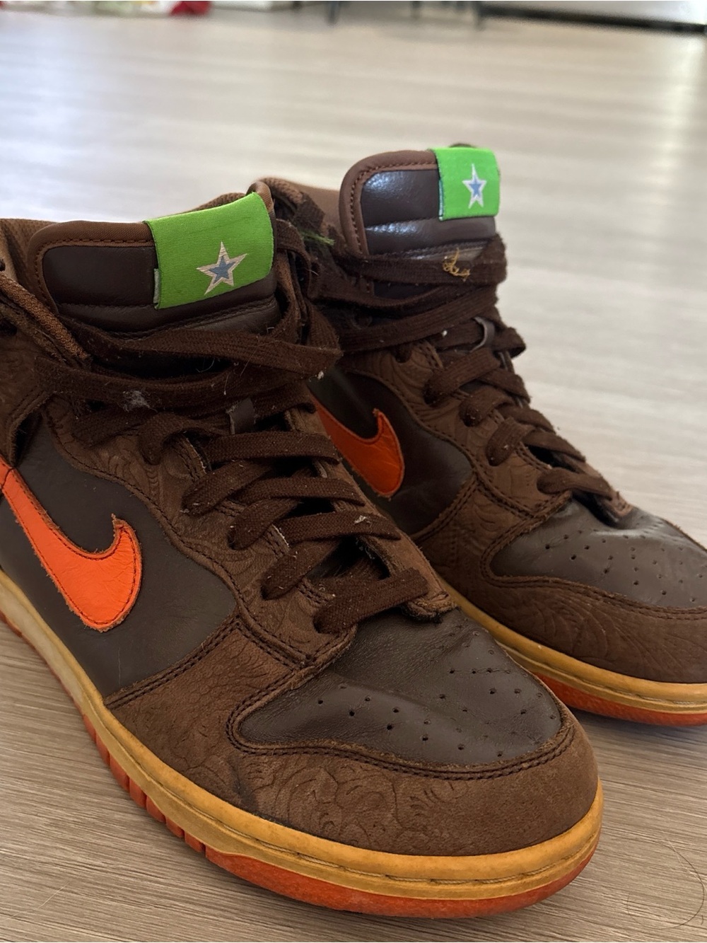 Nike Brown High-Top Sneakers with Orange Swoosh and Green Tongue